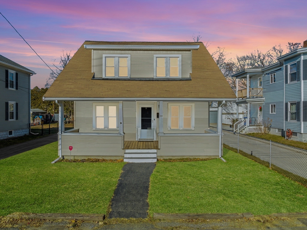 a front view of a house with a yard