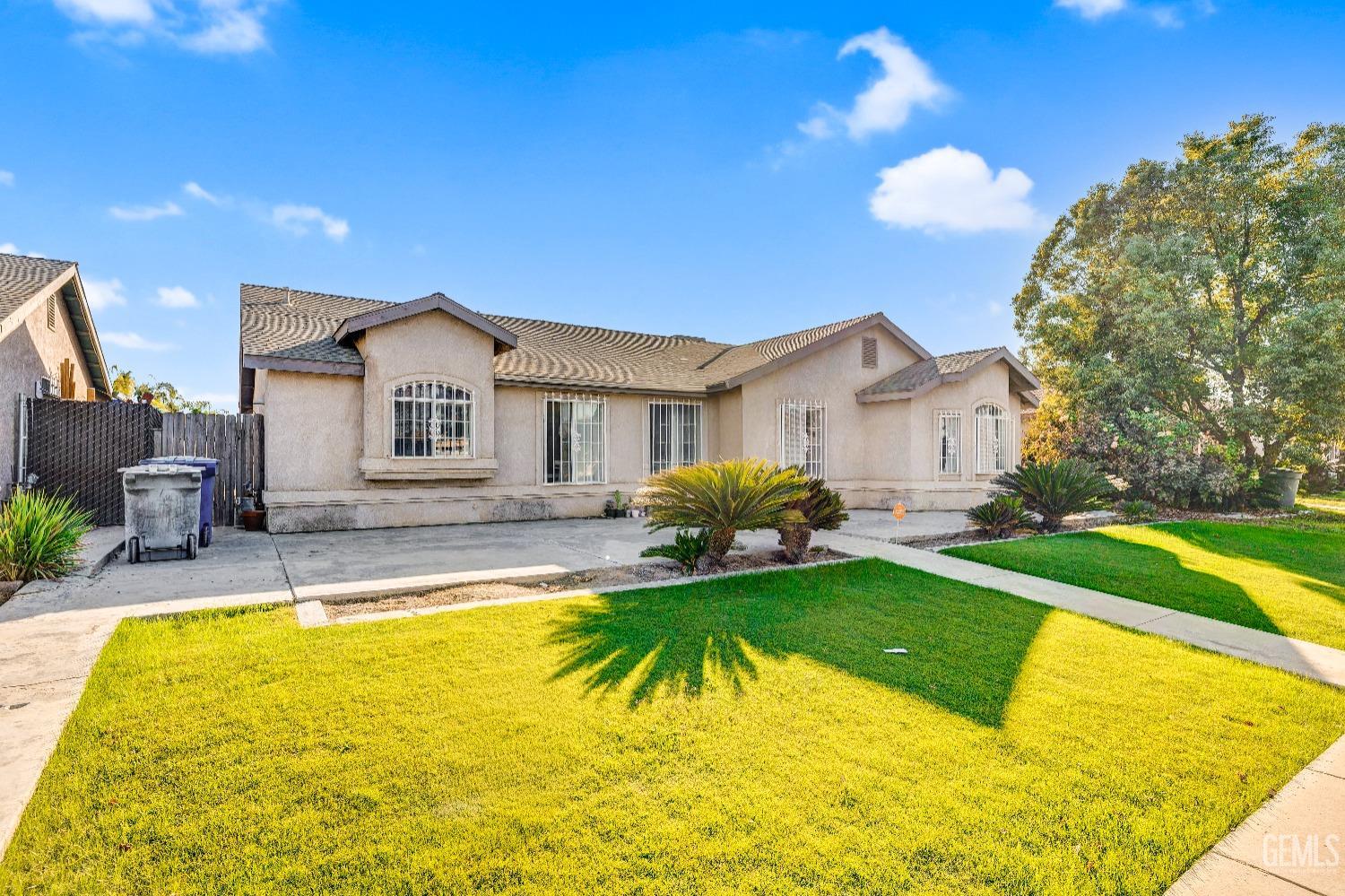 a view of a house with swimming pool and a yard