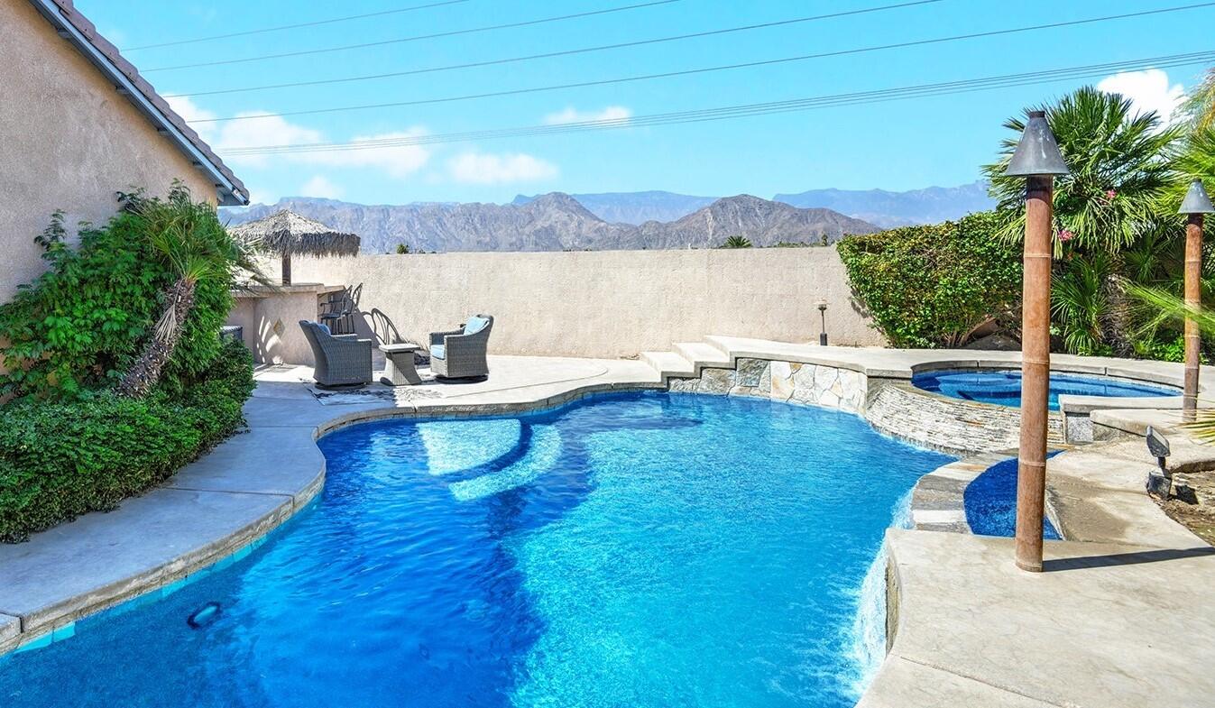 a view of a swimming pool with a patio