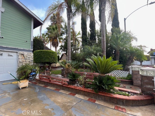 a backyard of a house with lots of green space and outdoor seating