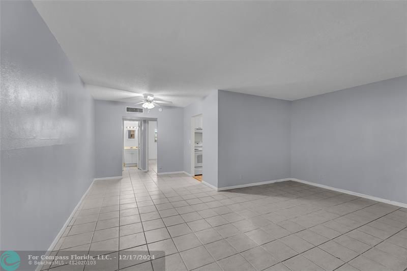 Spacious Living Room with Tile Flooring - staged photo