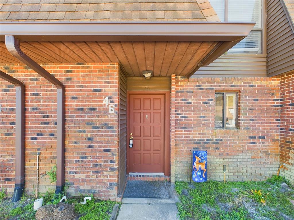 a view of front door with yellow door