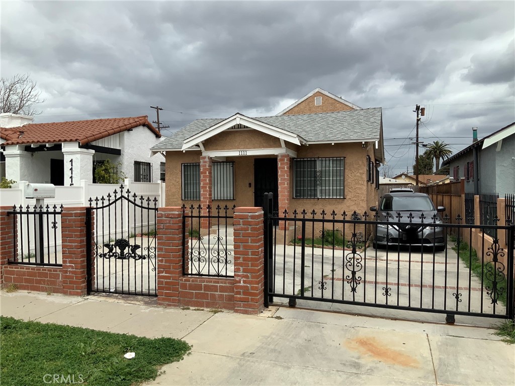 a front view of a house with a fence