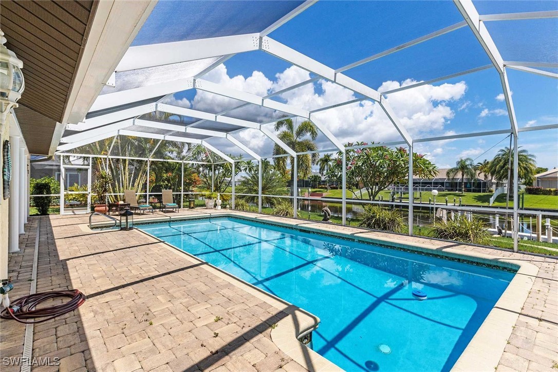 a view of a swimming pool with a patio