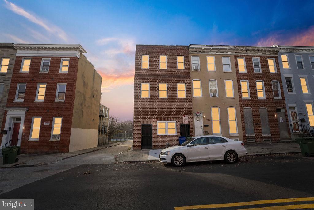 a view of a car parked in front of a building