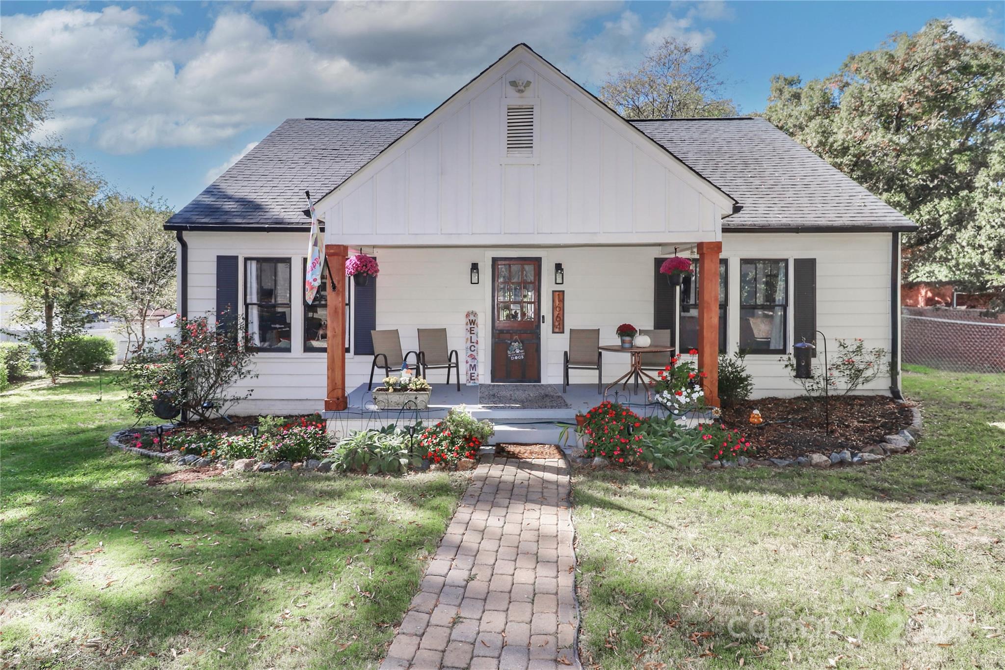 a front view of a house with garden