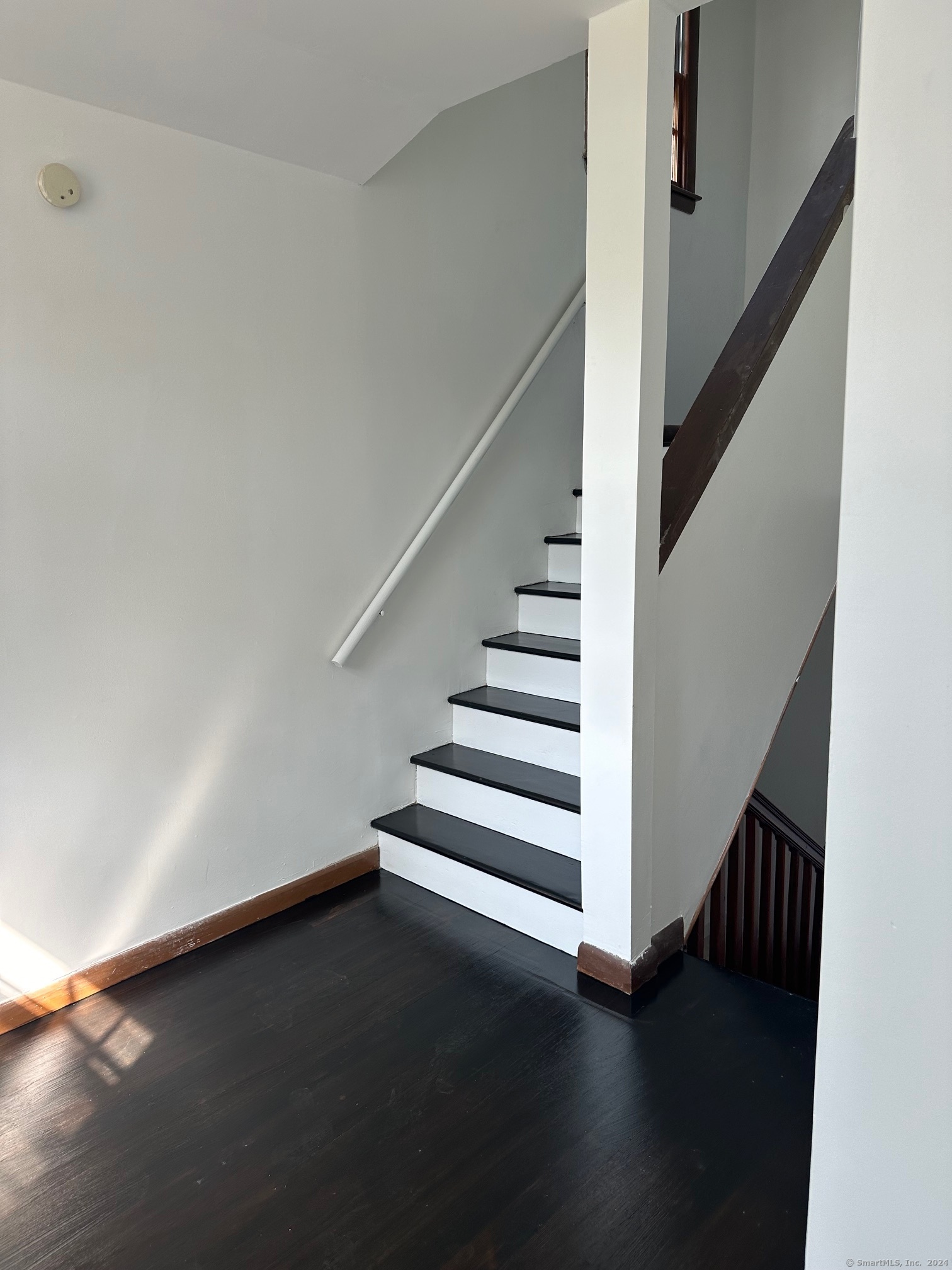 a view of entryway with wooden floor