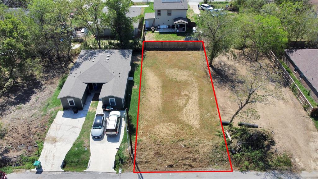 an aerial view of a house with outdoor space