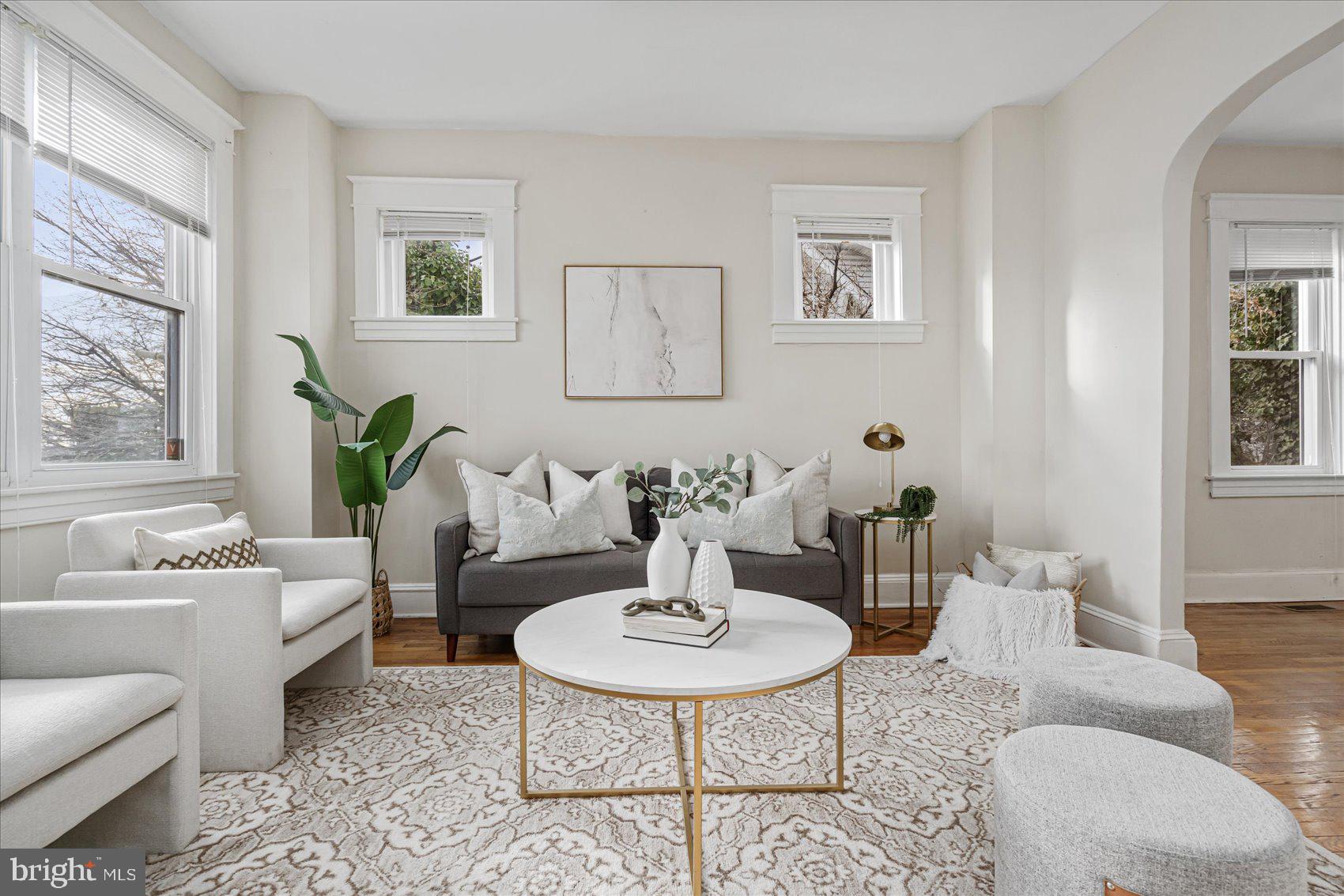 a living room with furniture and a table