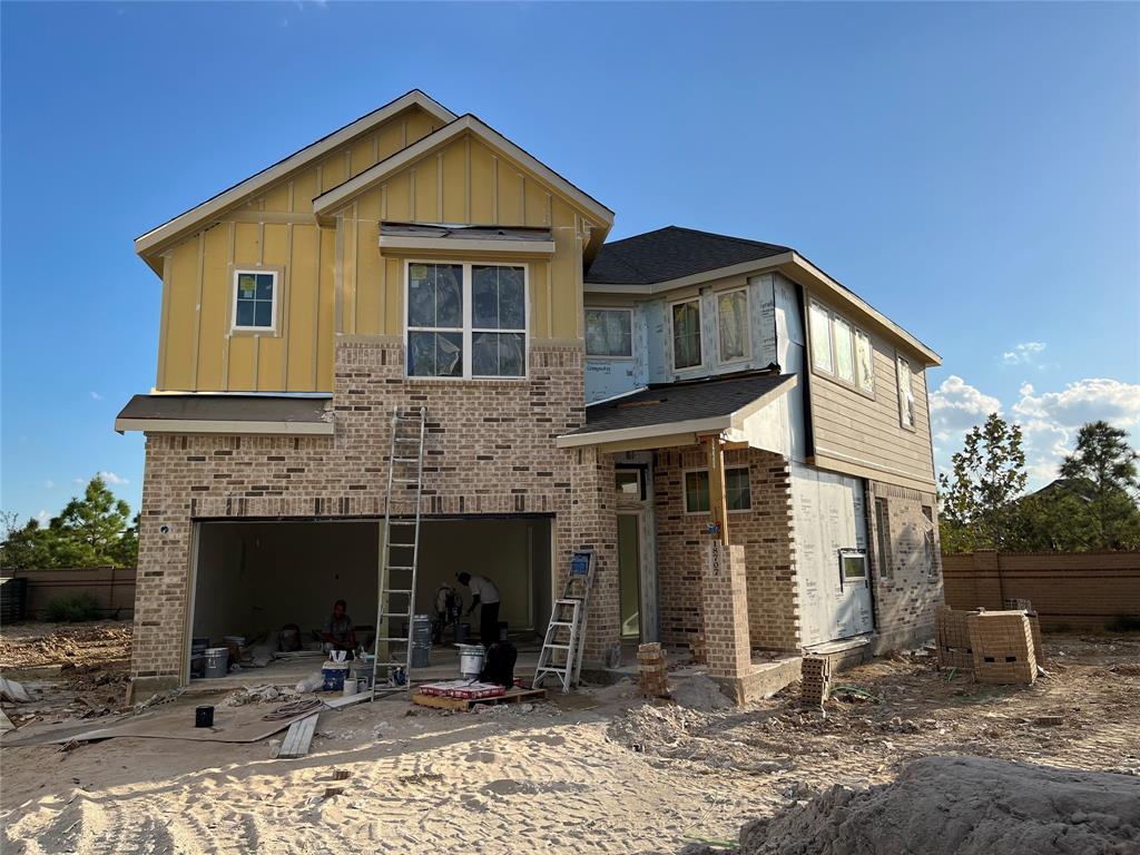 a front view of a house with yard and seating space