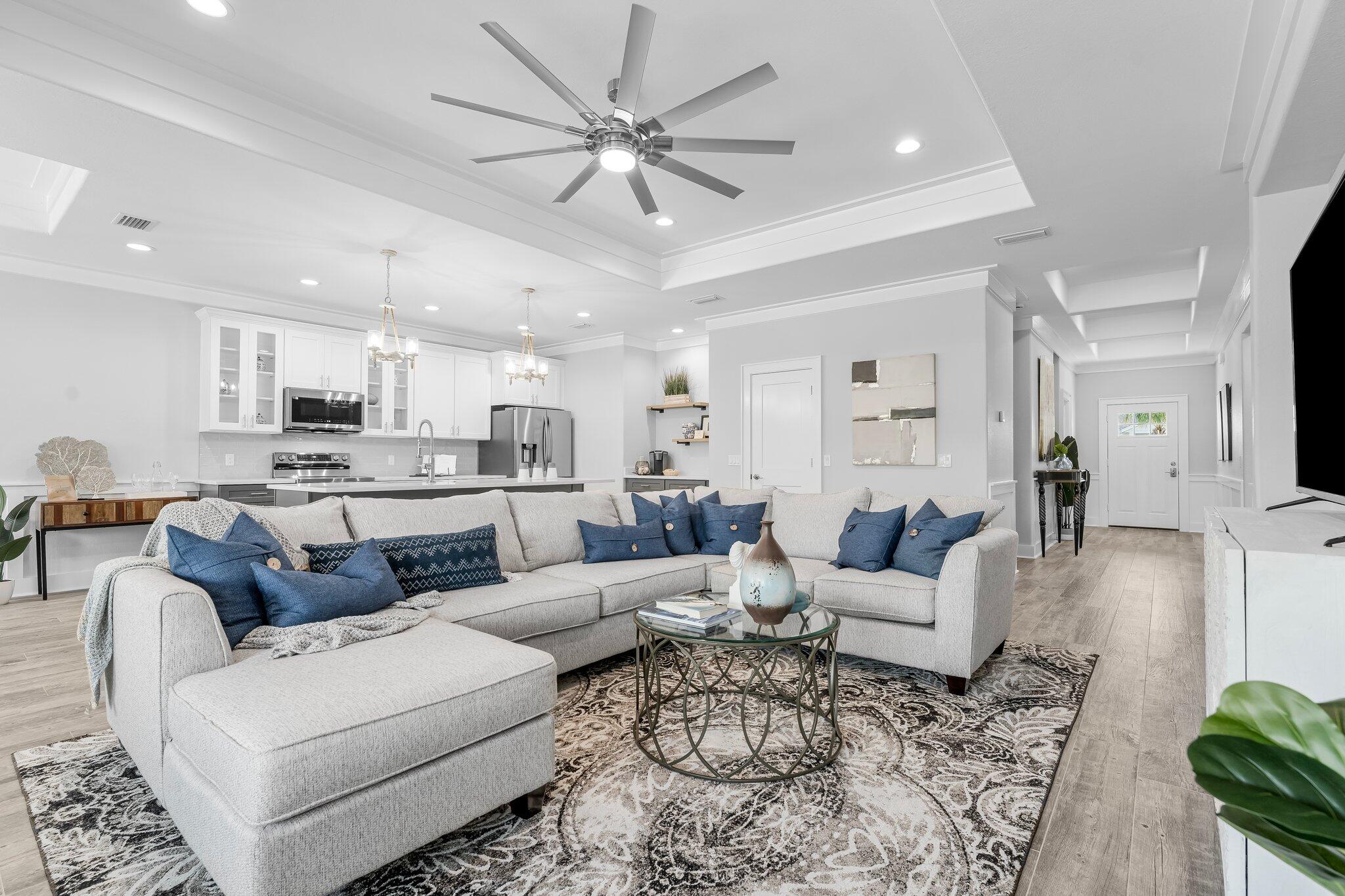 a living room with furniture white walls and white walls