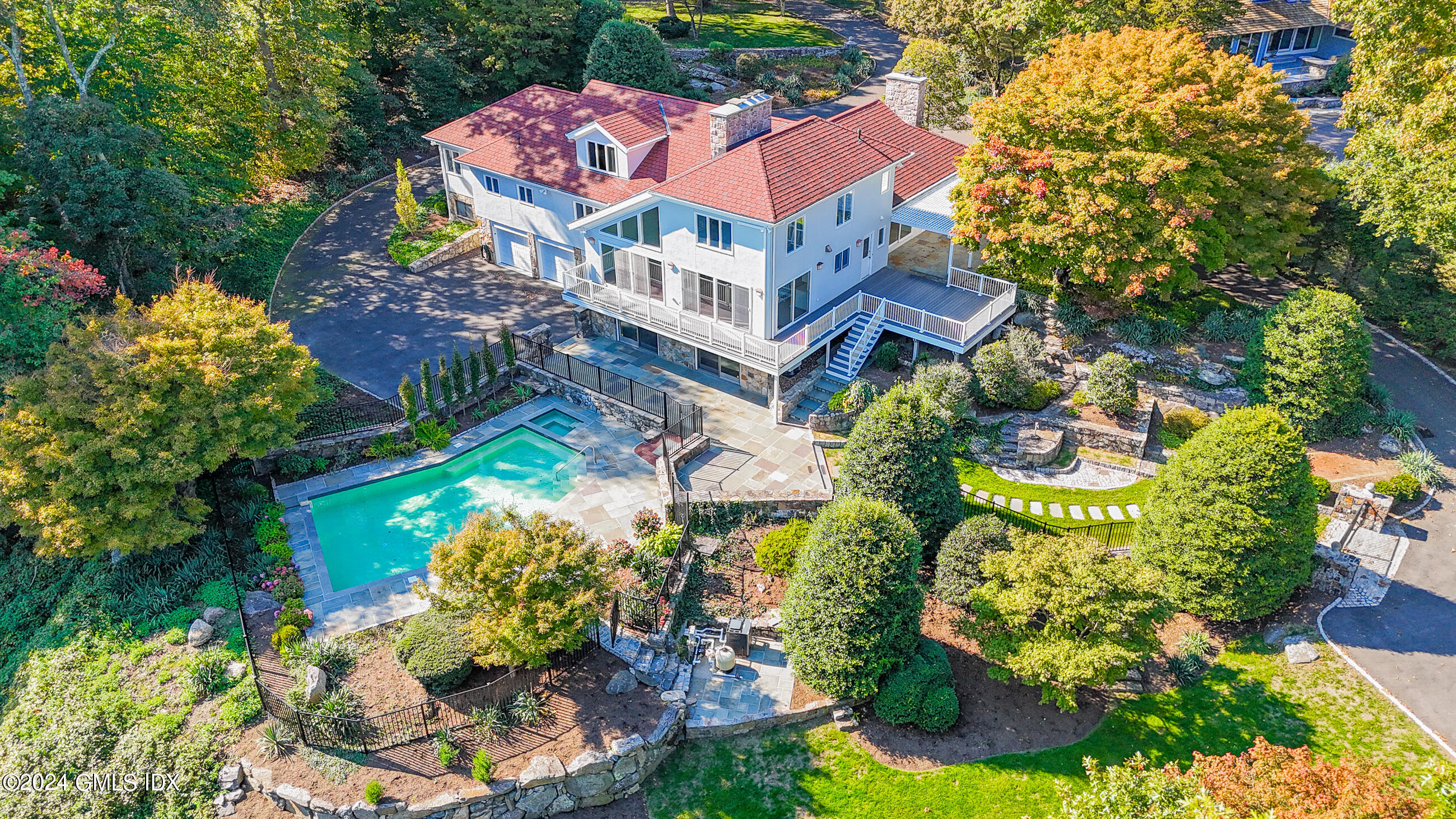 a aerial view of a house with a yard and garden