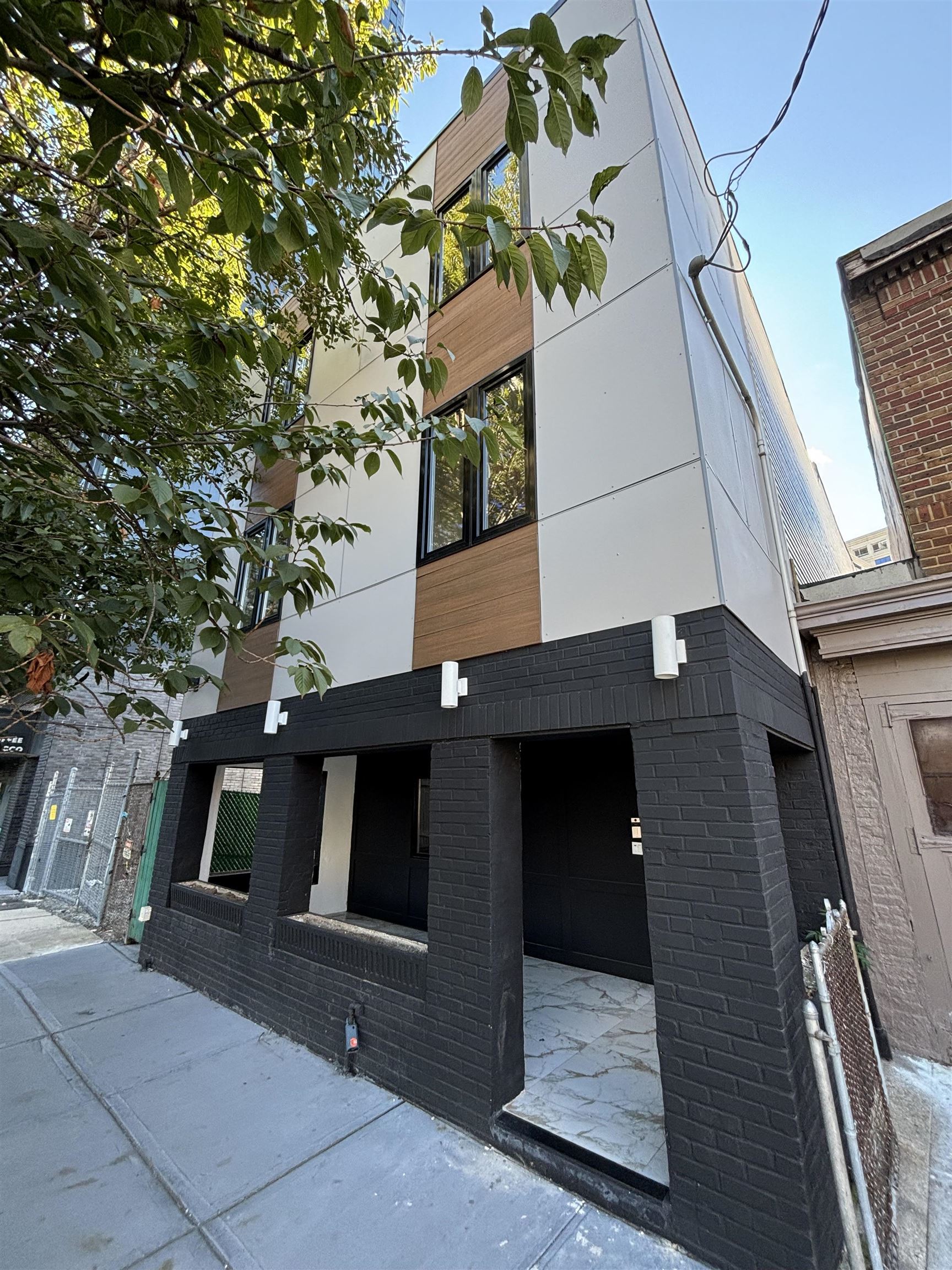 a view of a house with a tree