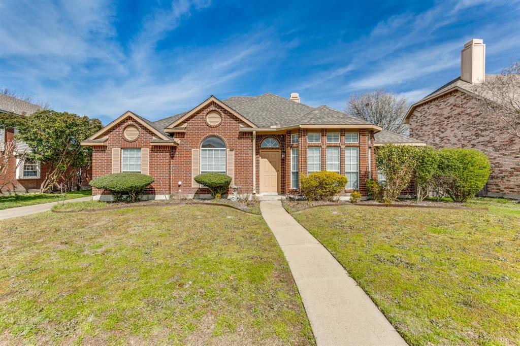 a front view of a house with yard