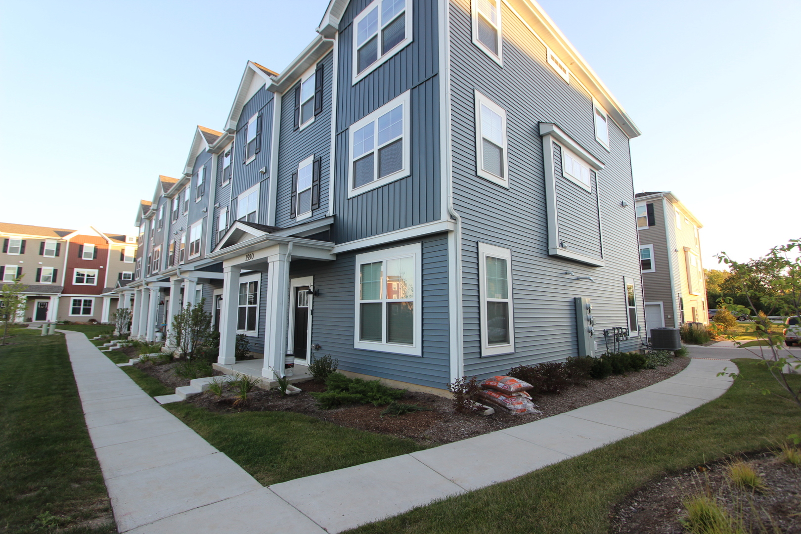 a view of a building with a yard