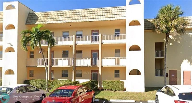 a front view of a building with street view