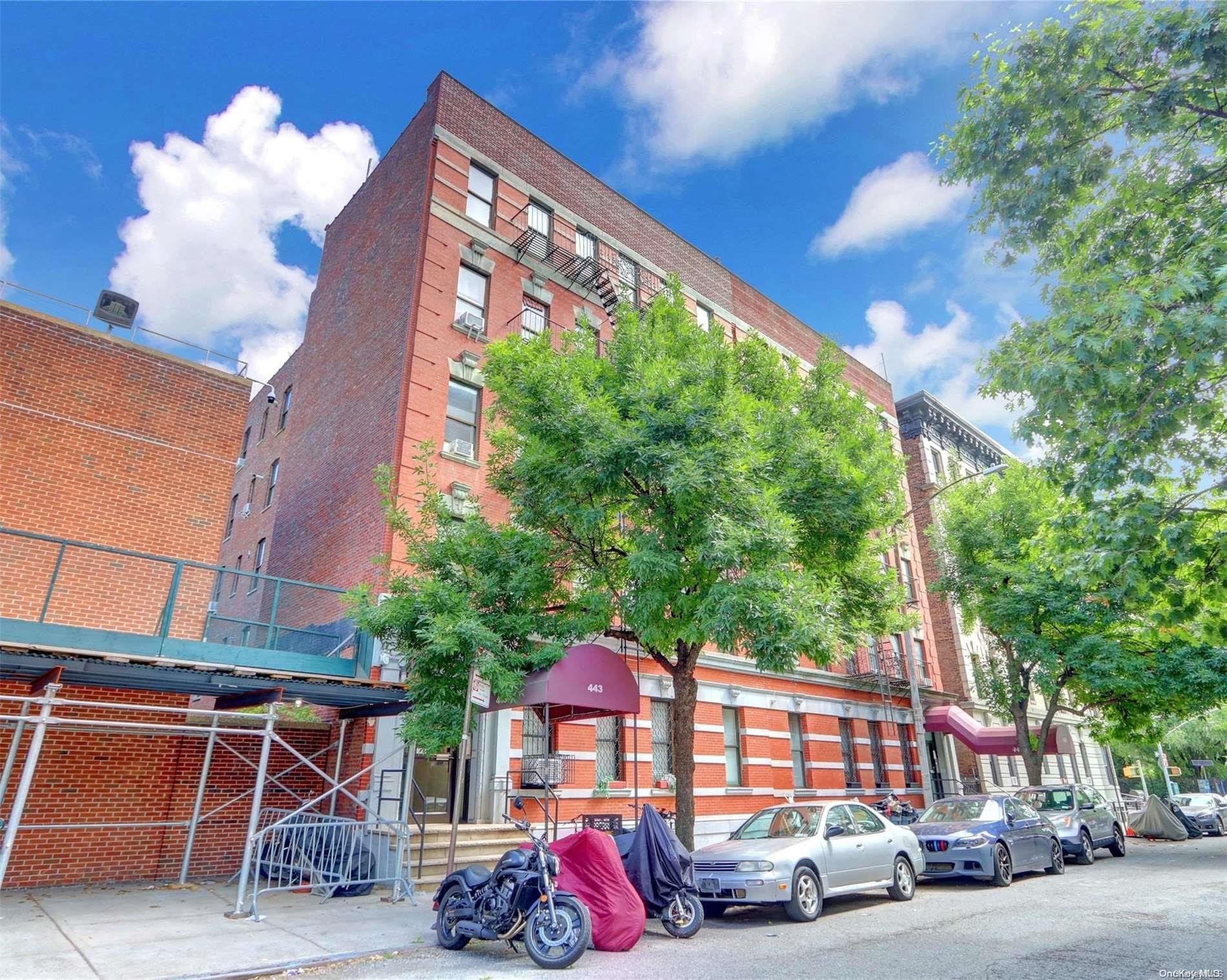 a red brick building with trees in front of it