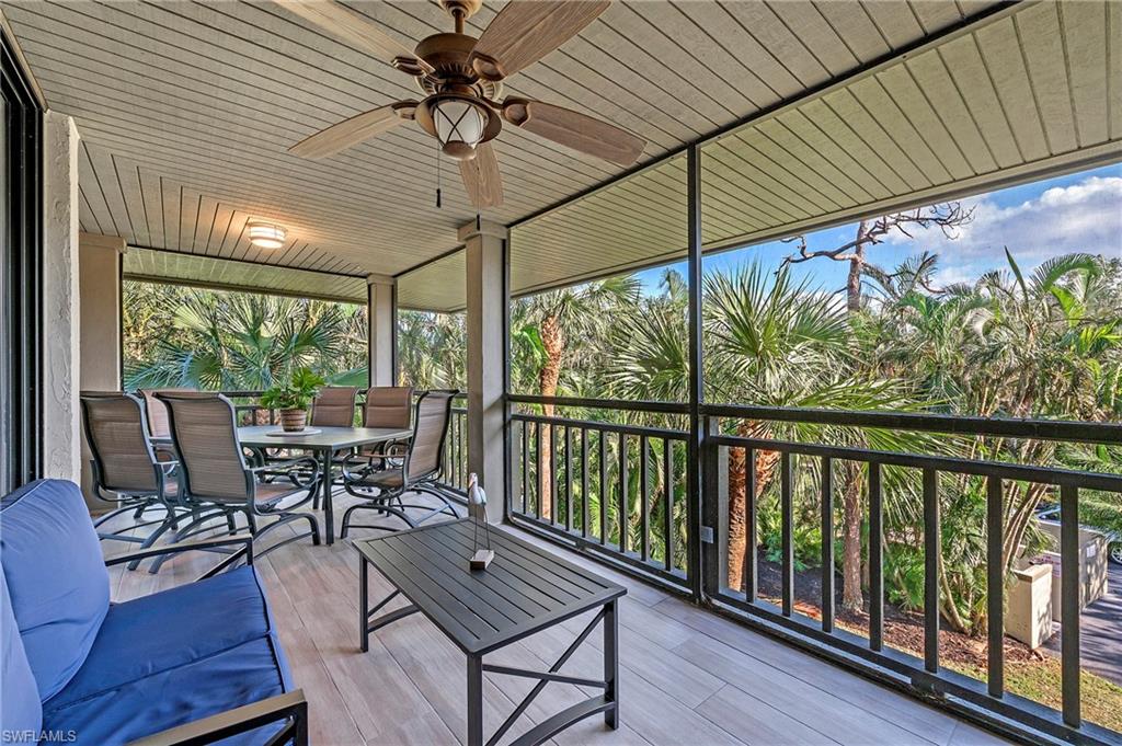 a view of a patio with a table chairs and backyard