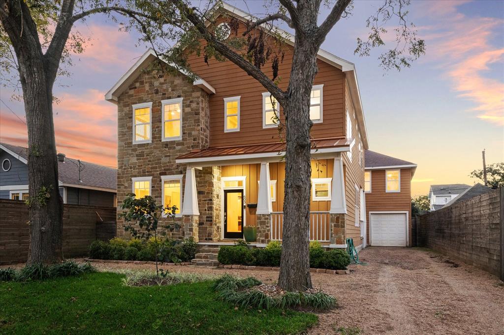 Pull up to this Texas style craftsman with a long driveway, front porch, and circular walking path.