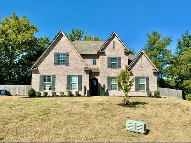 View of front of house with a front yard