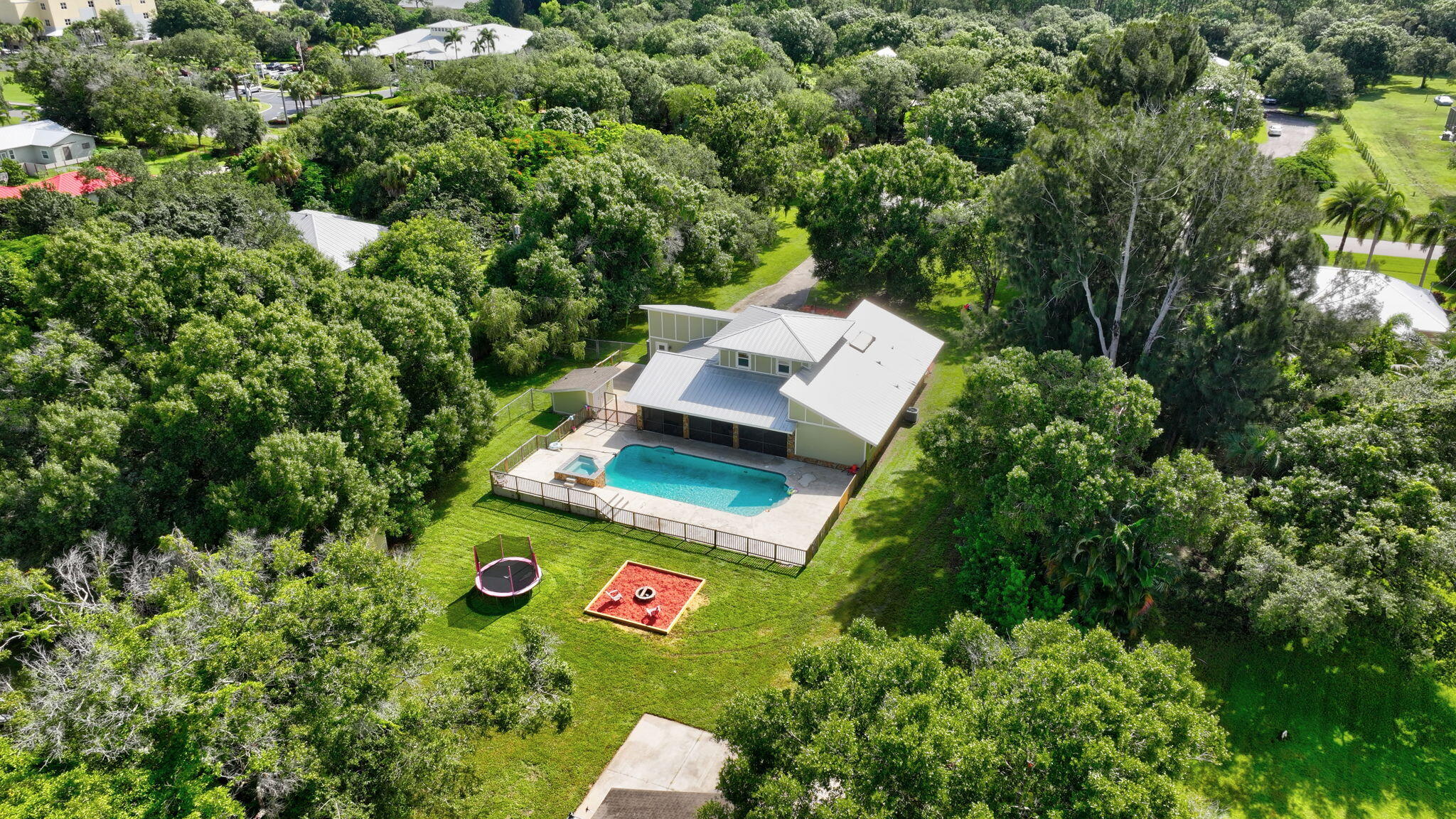 an aerial view of a house with yard