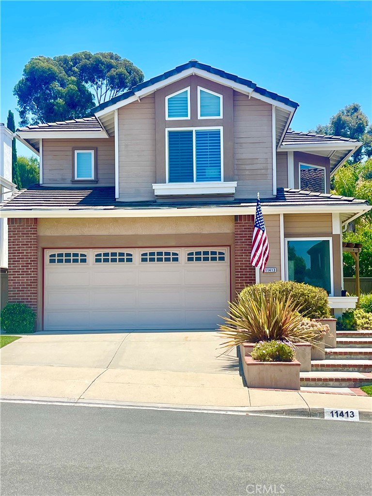 a front view of a house with a garage