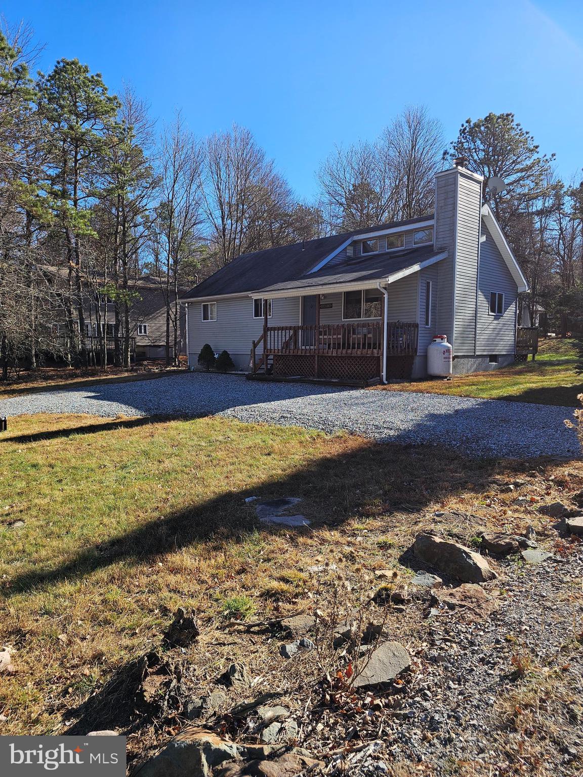 a view of a house with a yard and a large pool