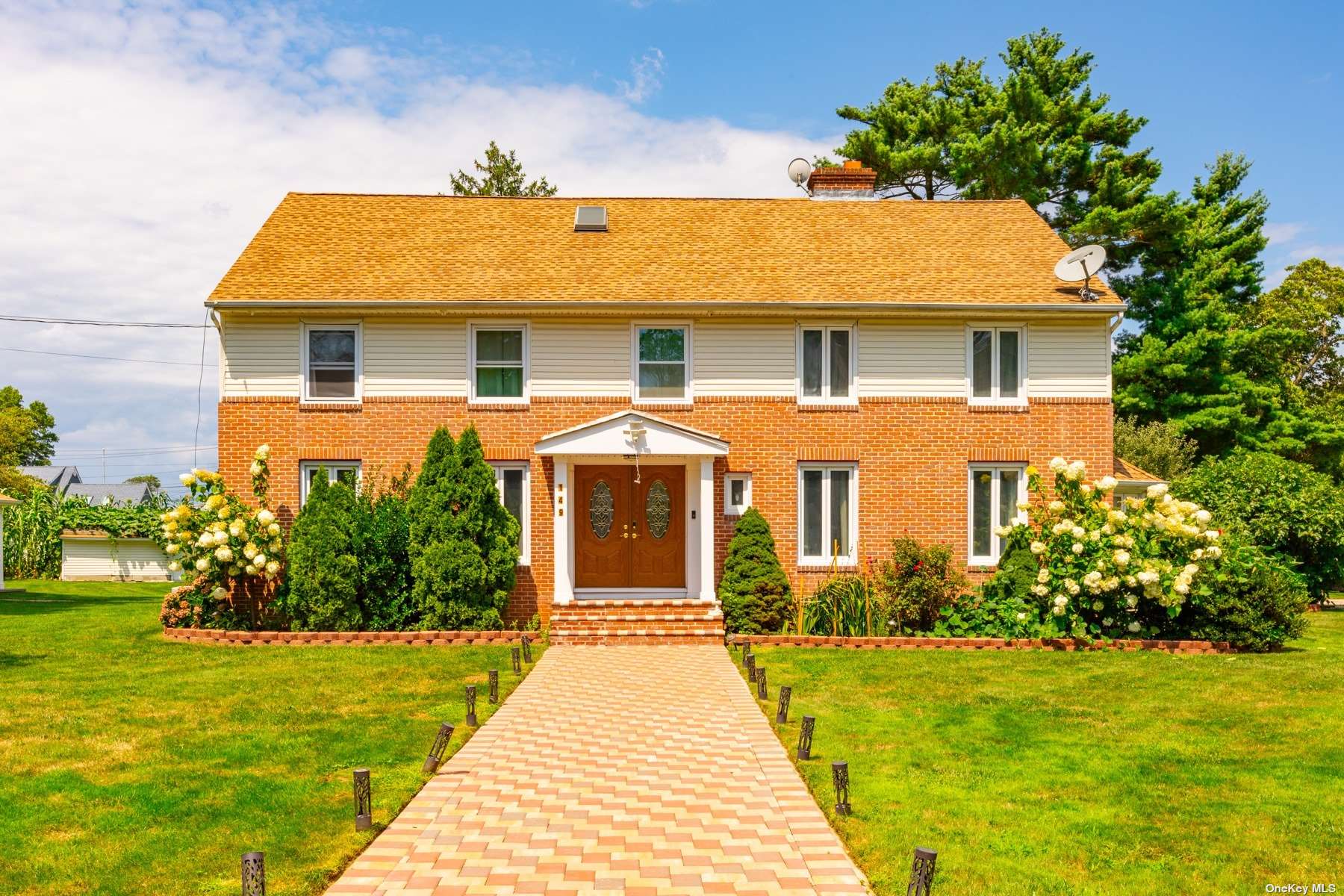 a front view of a house with garden