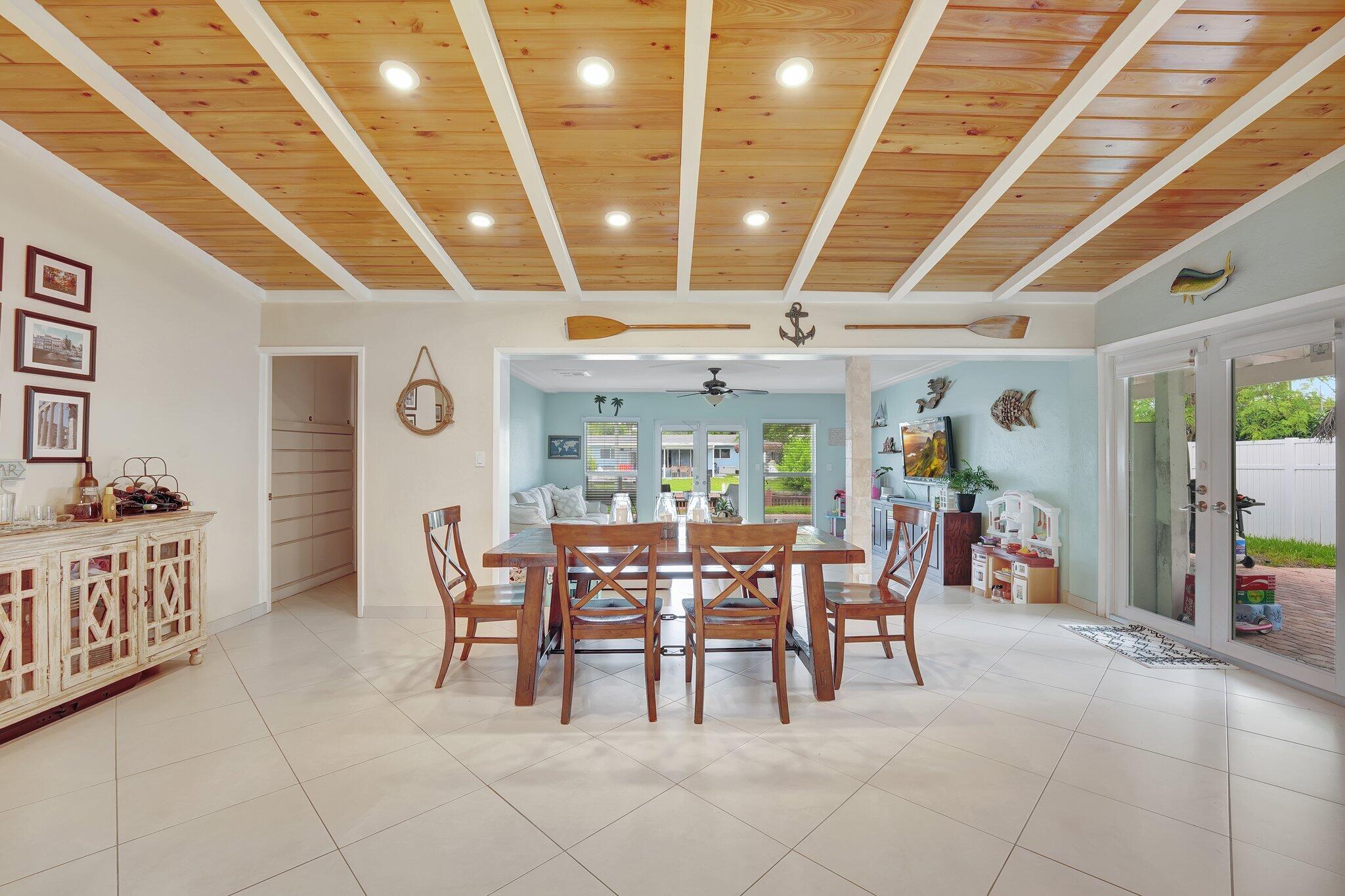 a dining room with furniture a chandelier and fireplace