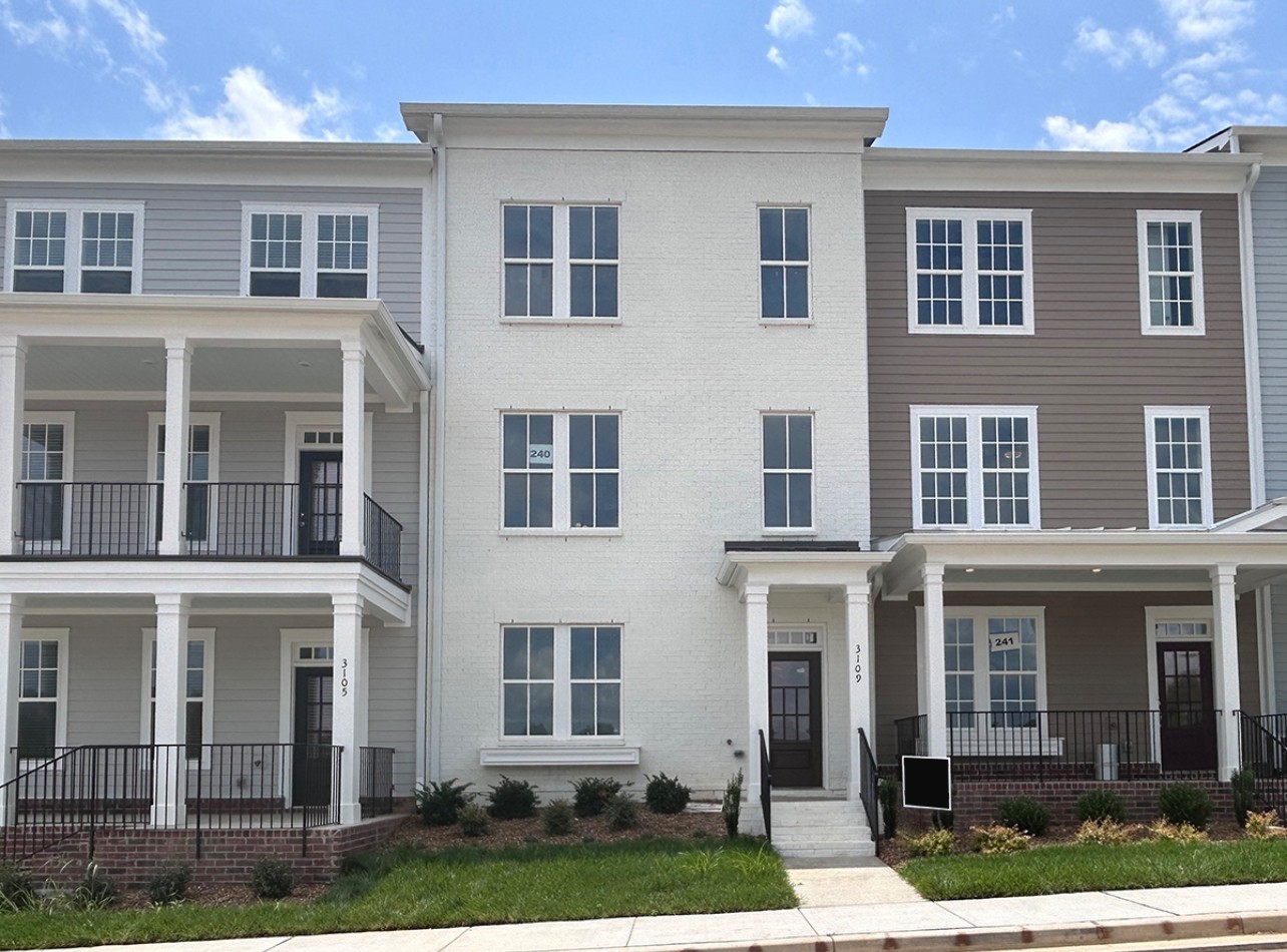 This townhome has a Gorgeous White Painted Brick Front.