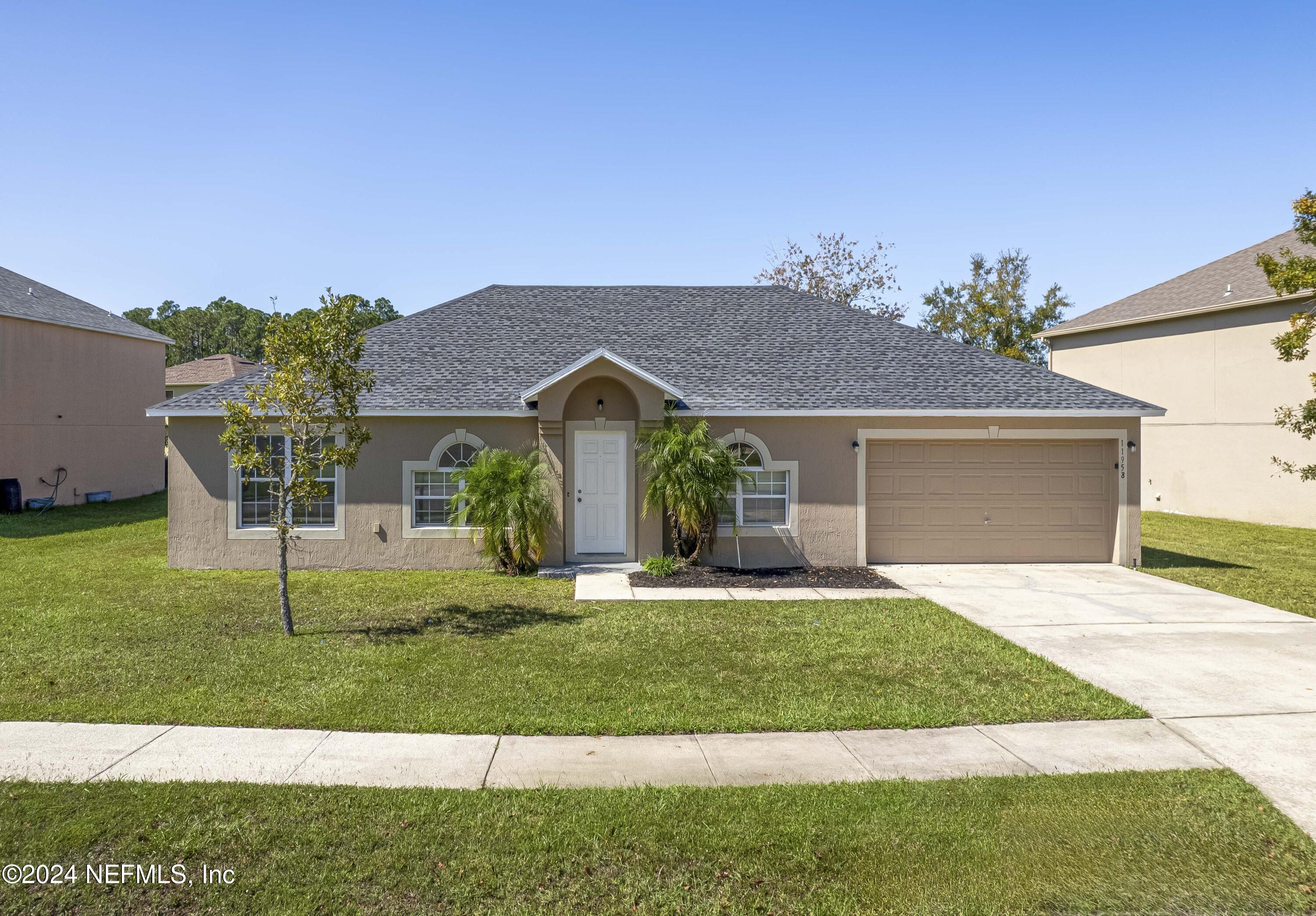 a front view of a house with a yard