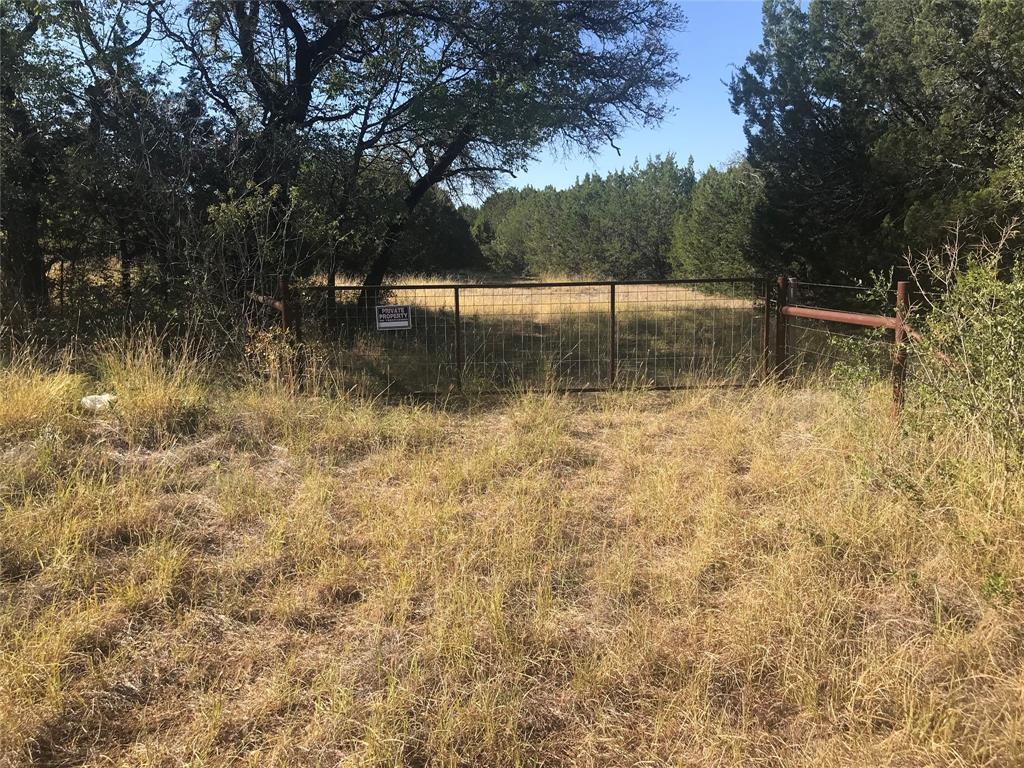 a view of lake with a yard