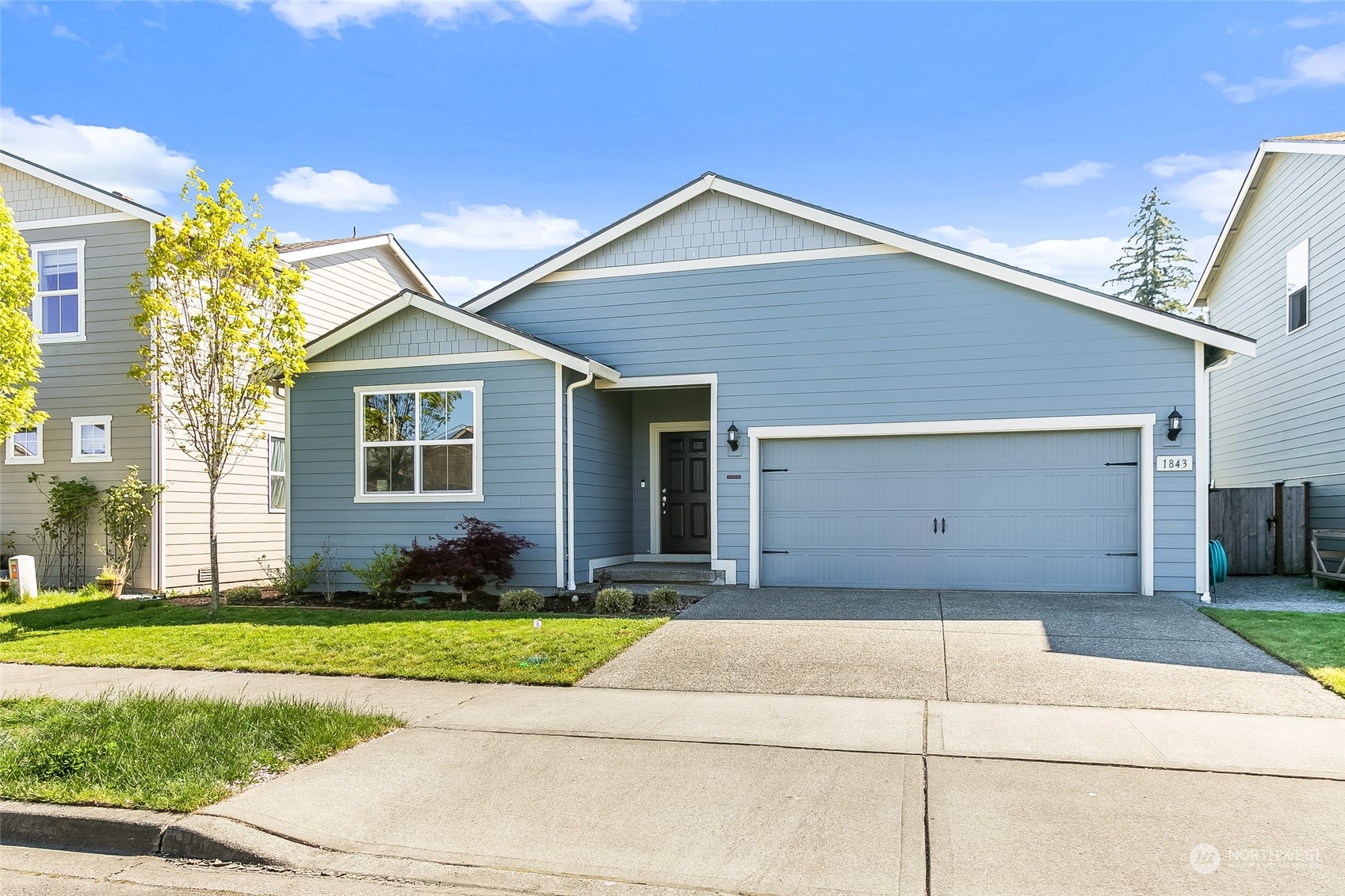 a front view of a house with a yard