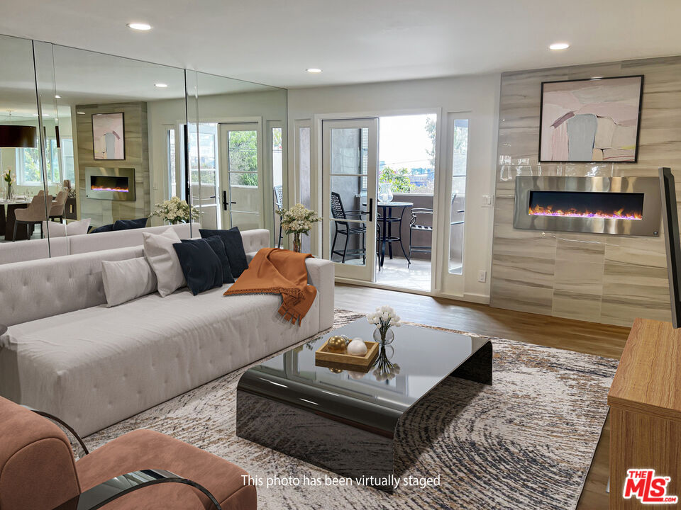 a living room with furniture and a rug