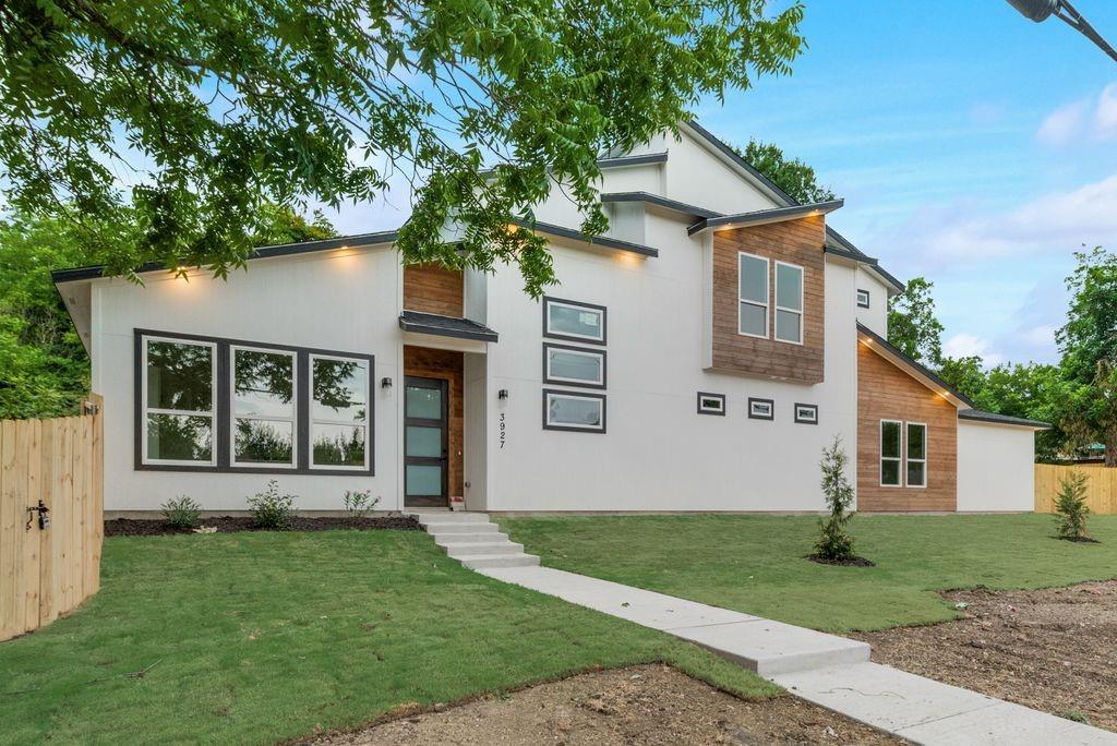 front view of a house with a yard