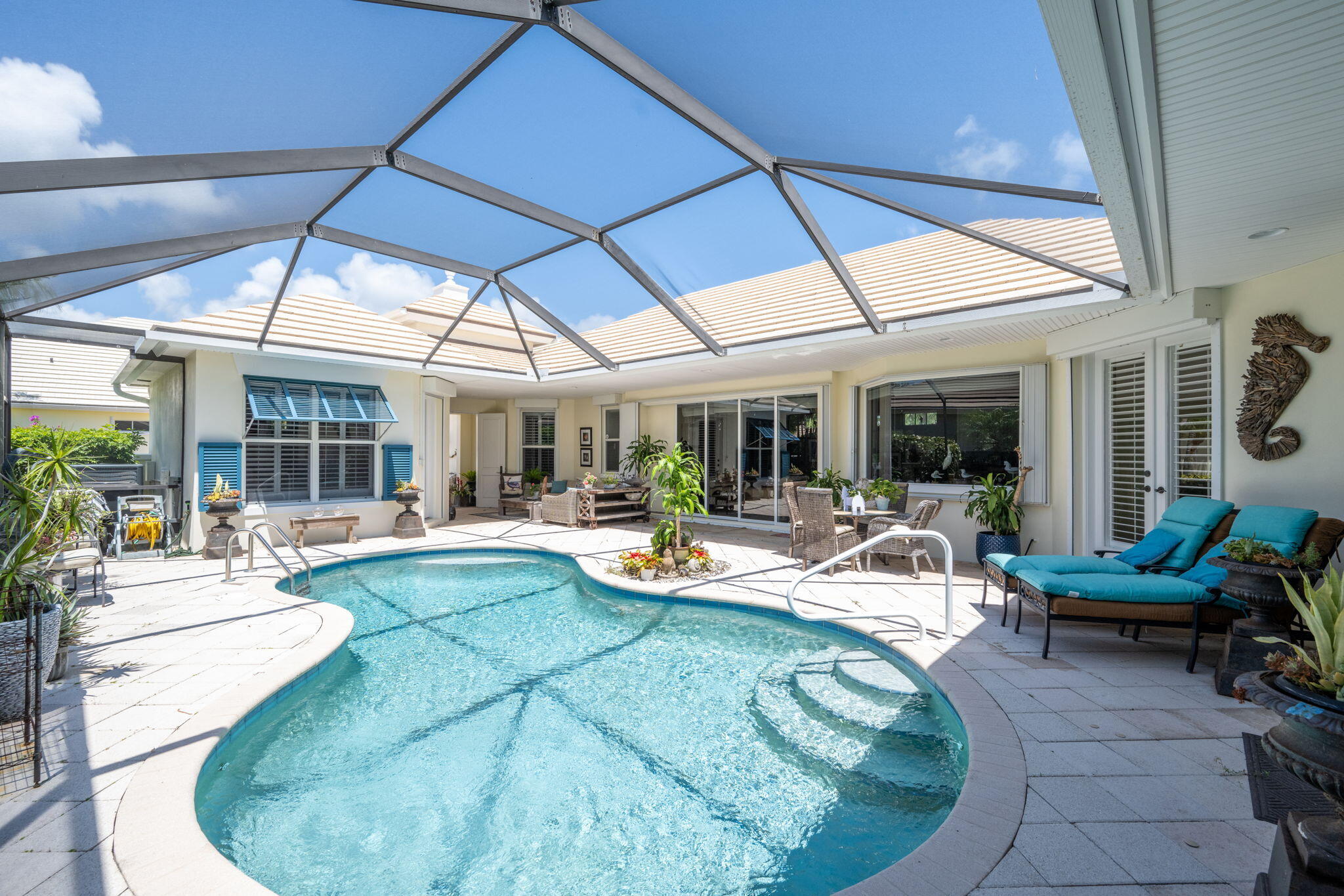 a view of a backyard with swimming pool