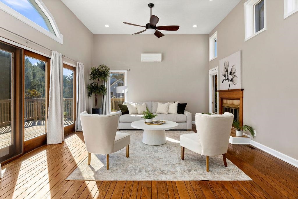 a view of a dining room with furniture wooden floor and a chandelier