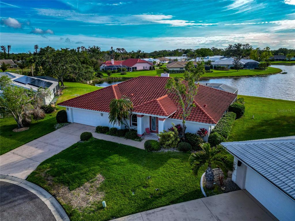 an aerial view of multiple houses with yard