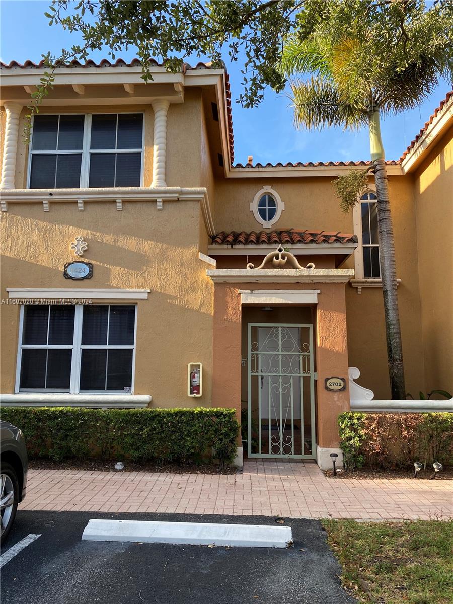 a front view of a house with yard