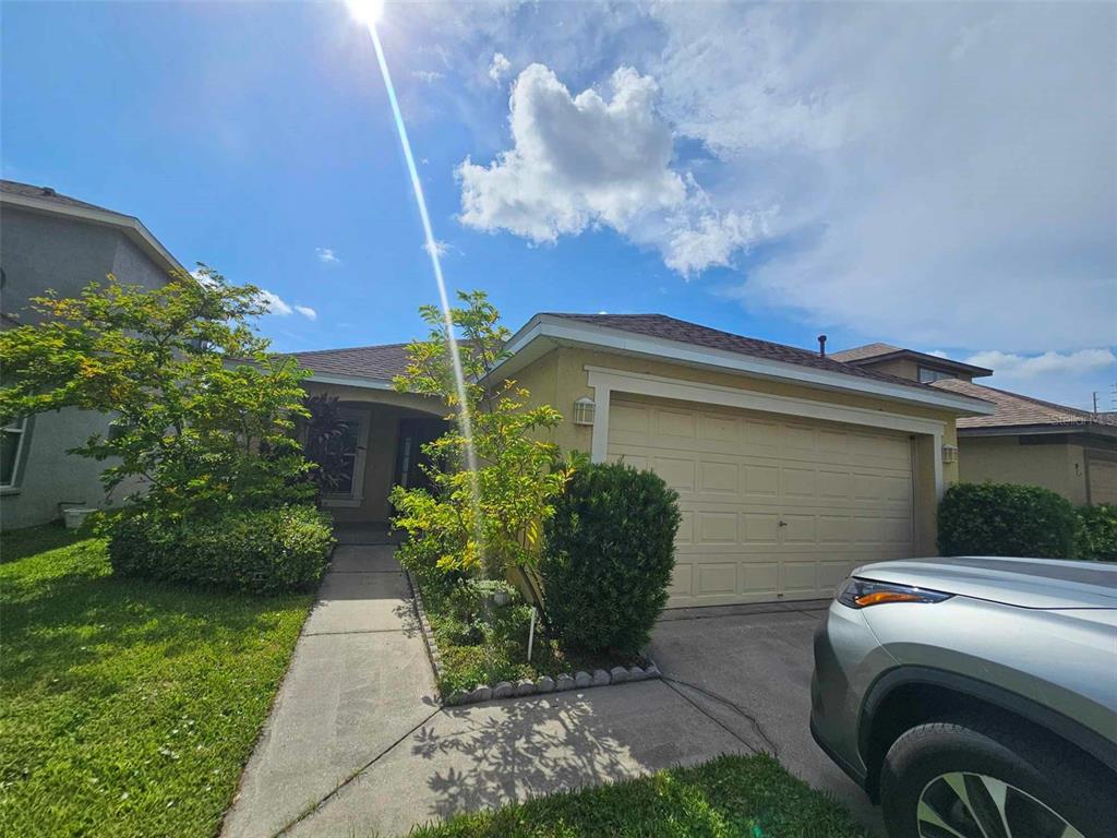 a front view of a house with garden