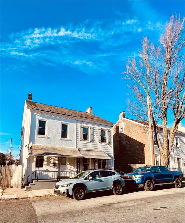 a car parked in front of a house