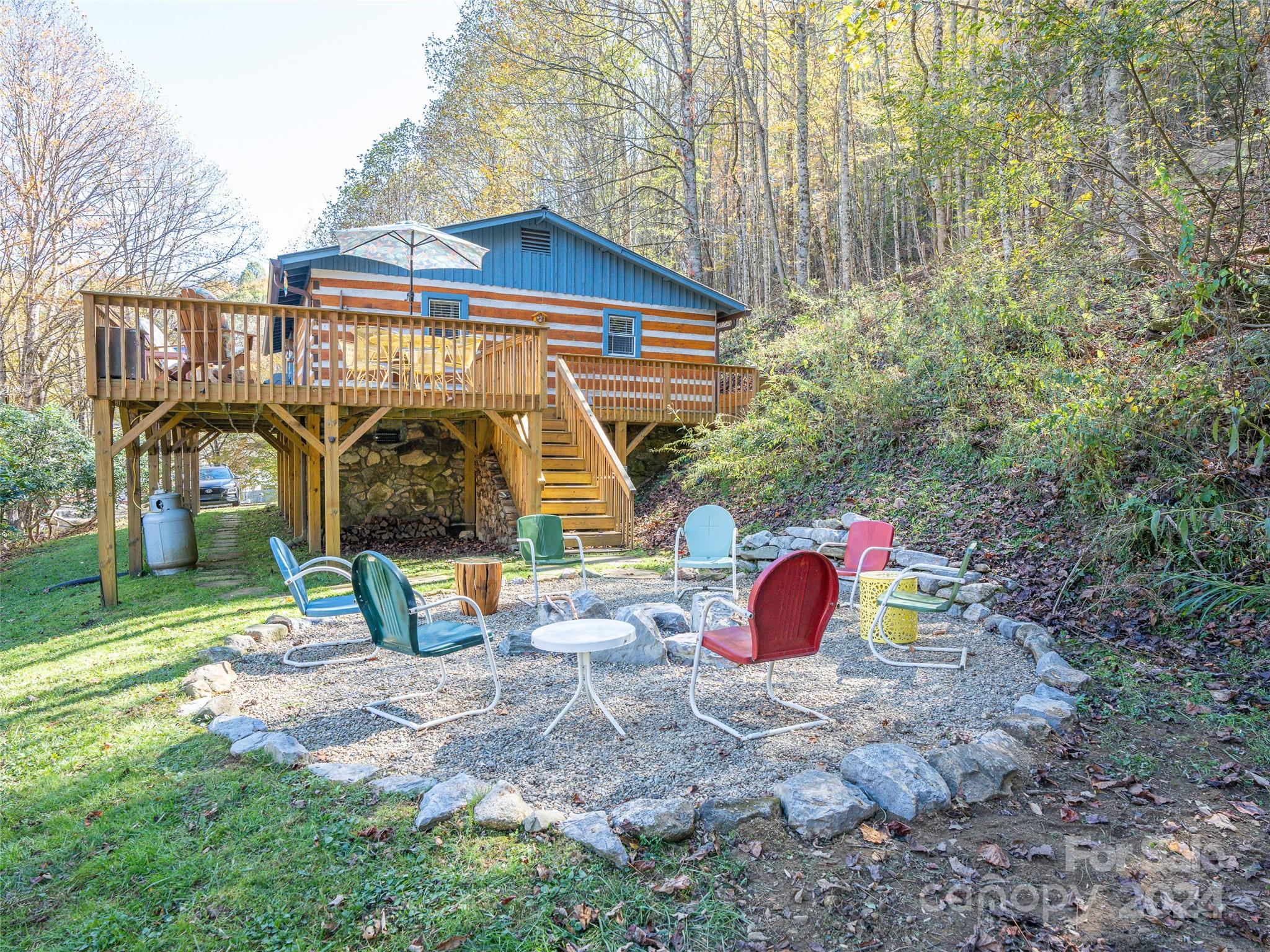 a view of backyard with wooden fence and a bench