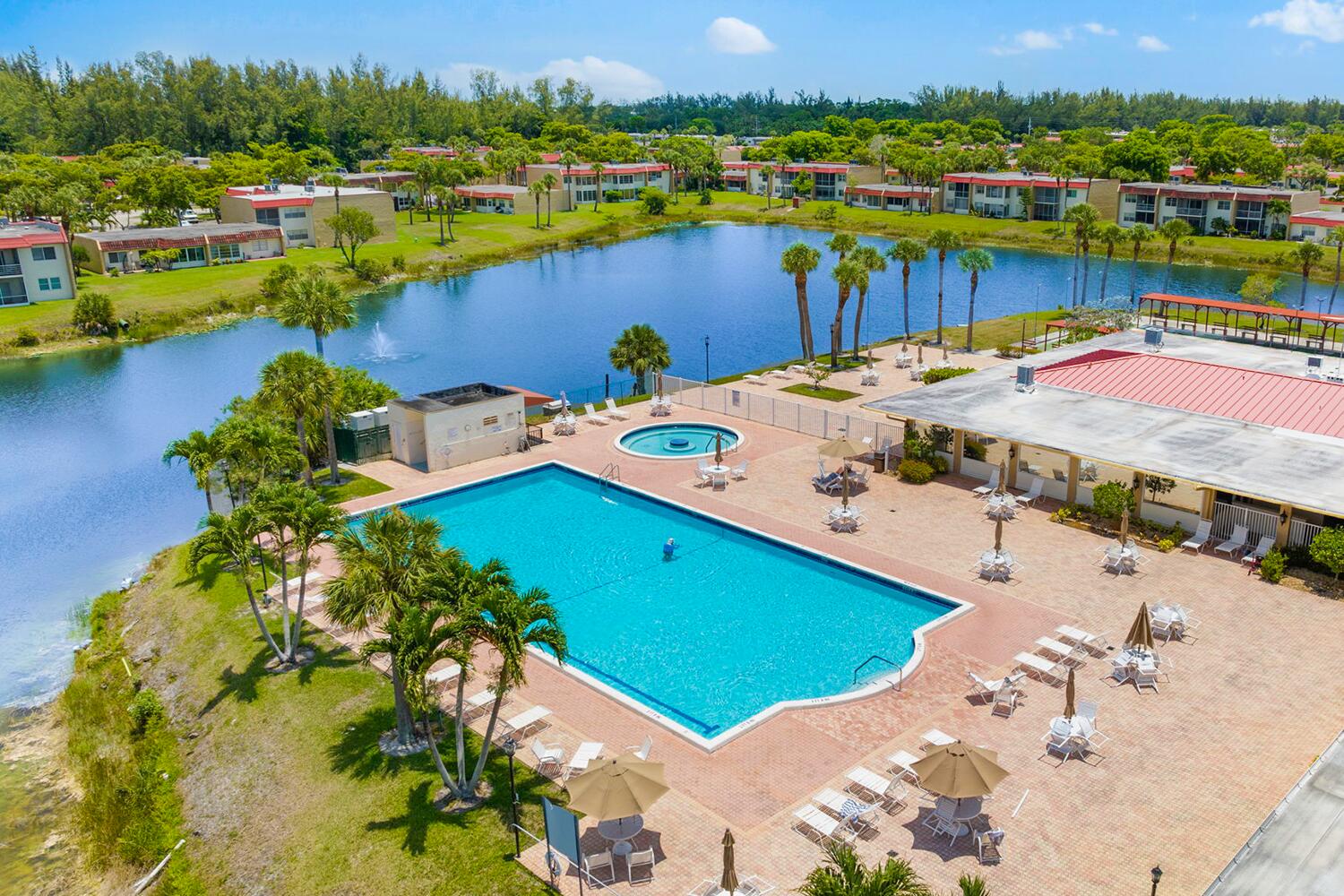 a view of a swimming pool with a lake view