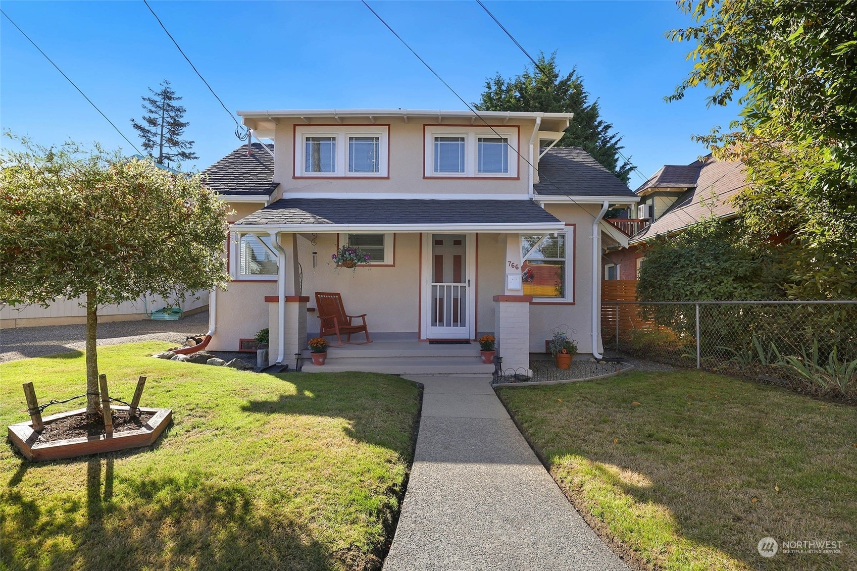 a view of a house with a yard porch and sitting area