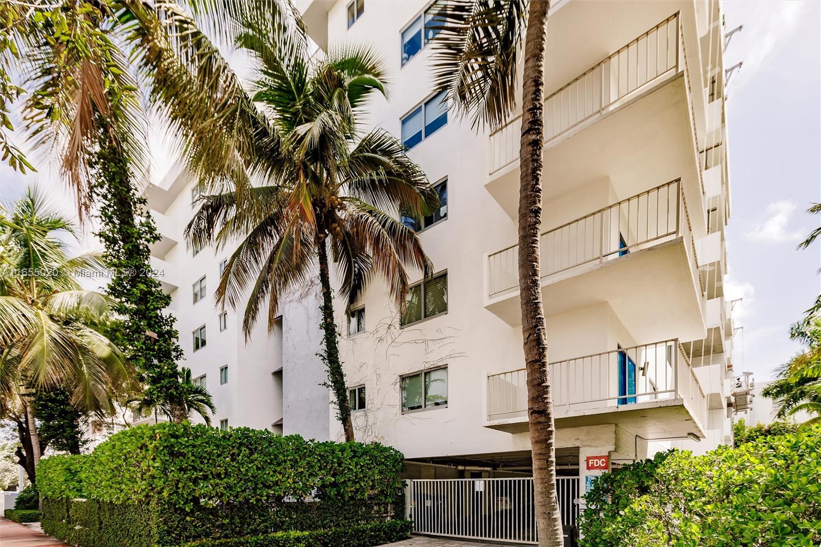 a view of a house with a palm tree