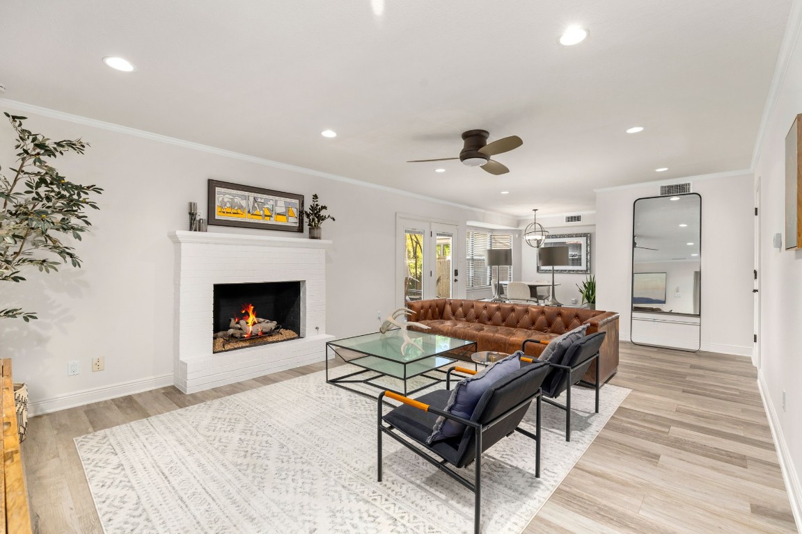 The welcoming family room opens beautifully to the sunny breakfast area off the kitchen making entertaining a breeze.