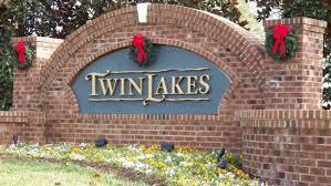 a street sign on a brick wall