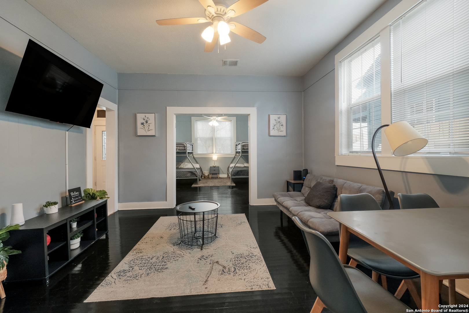 a living room with furniture and a flat screen tv