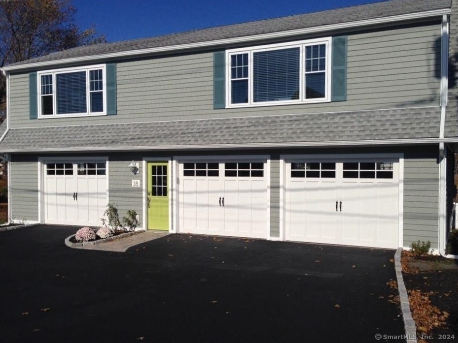 a front view of a house with a garage