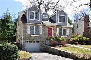 Charming Cape Cod home on no drive through street.